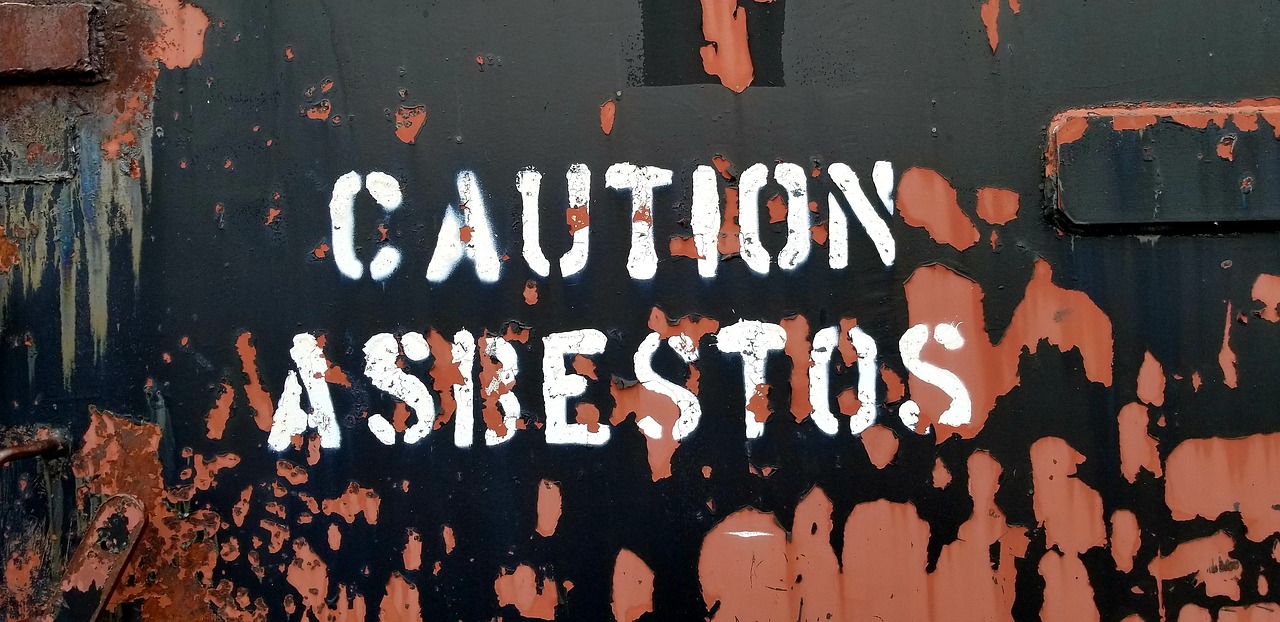 Asbestos warning at a property before renovation or demolition